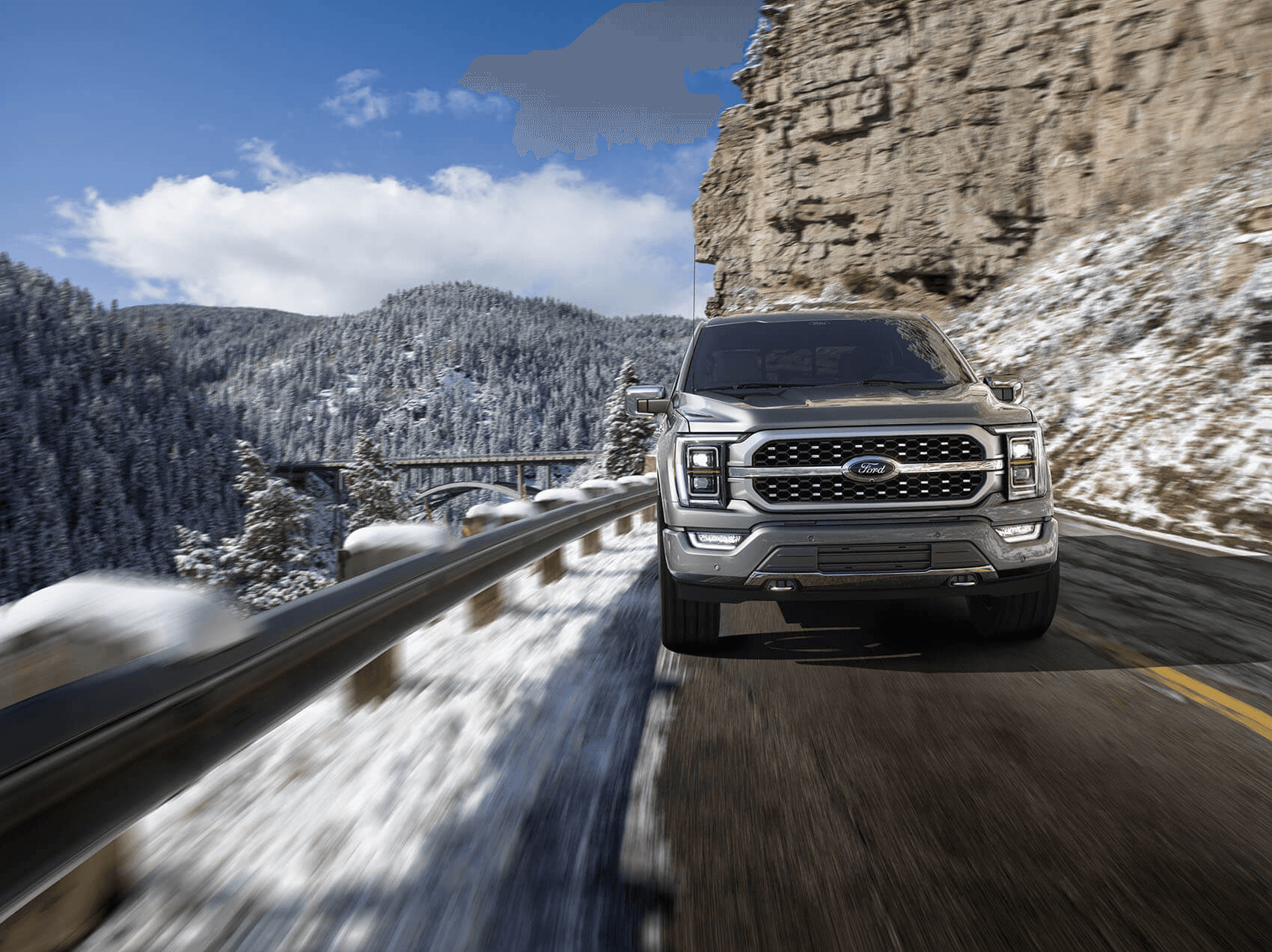 Ford F-150 driving on mountain road